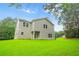Spacious backyard featuring a two-story home with lush green lawn at 156 Club Cir, Stockbridge, GA 30281