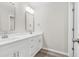 Bright bathroom features dual sinks, modern fixtures, and white cabinets for ample storage at 156 Club Cir, Stockbridge, GA 30281
