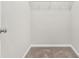 Small closet with wire shelving and neutral carpeting at 156 Club Cir, Stockbridge, GA 30281
