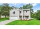 Two-story home with well-manicured lawn, attached garage and inviting curb appeal at 156 Club Cir, Stockbridge, GA 30281
