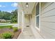 Inviting front porch with brick accents and stylish overhead lighting fixtures at 156 Club Cir, Stockbridge, GA 30281