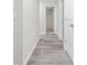 Hallway features hard surface floors and white doors at 156 Club Cir, Stockbridge, GA 30281
