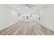 Open-concept living space with wood floors, recessed lighting, and kitchen island at 156 Club Cir, Stockbridge, GA 30281