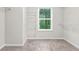 Walk-in closet features wire shelving and a window for natural light at 156 Club Cir, Stockbridge, GA 30281