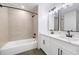 Bathroom featuring a tiled shower/bathtub combination and a double vanity at 3292 Holly Mill Ct, Marietta, GA 30062