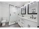 Modern bathroom with a glass-enclosed shower, double vanity, and sleek fixtures at 3292 Holly Mill Ct, Marietta, GA 30062