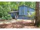 Stylish blue two-story home with a modern design, natural landscaping, and a welcoming front entrance at 3292 Holly Mill Ct, Marietta, GA 30062