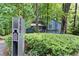 Home's exterior view surrounded by a natural landscape and featuring the house number in clear view at 3292 Holly Mill Ct, Marietta, GA 30062