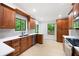 Bright updated kitchen includes stainless appliances, quartz countertops, and a large window at 3292 Holly Mill Ct, Marietta, GA 30062
