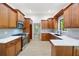 Modern kitchen features stainless steel appliances, ample cabinet space, and quartz countertops at 3292 Holly Mill Ct, Marietta, GA 30062