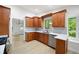 The updated kitchen features stainless appliances, lots of storage, and light wood flooring at 3292 Holly Mill Ct, Marietta, GA 30062