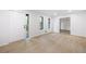 Spacious living room with new flooring, neutral walls, and an open layout, leading to other rooms at 3292 Holly Mill Ct, Marietta, GA 30062