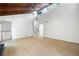 Bright living room boasts a high ceiling with exposed wood beams and light wood flooring at 3292 Holly Mill Ct, Marietta, GA 30062