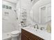 Modern bathroom with marble tile, rainfall shower, and stylish vanity at 4642 Orchid Dr, Pine Lake, GA 30072