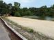 Lake community beach with playground, and sandy beach at 4642 Orchid Dr, Pine Lake, GA 30072
