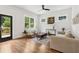 Comfortable living room with hardwood floors, modern decor, neutral tones and ample natural light at 4642 Orchid Dr, Pine Lake, GA 30072