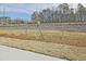 View of the front yard featuring newly planted shrubs and a grassy lawn at 687 Sunstone Ln, Lawrenceville, GA 30043