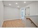 Stairway hallway area with hardwood flooring and white base trim at 687 Sunstone Ln, Lawrenceville, GA 30043