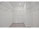 Walk-in closet with wire shelving for organized storage of clothes and accessories at 695 Sunstone Ln, Lawrenceville, GA 30043