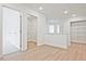 Hallway featuring wood floors, neutral paint, and lots of natural light at 695 Sunstone Ln, Lawrenceville, GA 30043