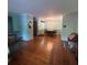 Spacious living room featuring hardwood floors, neutral walls, and a chandelier at 1164 Rogeretta Ne Dr, Atlanta, GA 30329