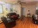 Inviting living room features hardwood floors, a ceiling fan and access to another room at 1164 Rogeretta Ne Dr, Atlanta, GA 30329