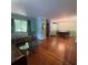 Spacious living room featuring hardwood floors, neutral walls, and a chandelier at 1164 Rogeretta Ne Dr, Atlanta, GA 30329