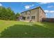 Expansive backyard features a patio, a basketball hoop and green lawn at 425 Eldridge Drive Dr, Suwanee, GA 30024