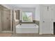 This bathroom has a soaking tub and stand up shower at 425 Eldridge Drive Dr, Suwanee, GA 30024