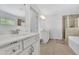 Bright bathroom features double vanities, tiled floor, and a glass-enclosed shower at 425 Eldridge Drive Dr, Suwanee, GA 30024