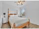 This bedroom features a wood frame bed, ceiling fan, and plenty of natural light at 425 Eldridge Drive Dr, Suwanee, GA 30024