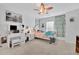 This bedroom has a vanity, large window, and decorative wall art at 425 Eldridge Drive Dr, Suwanee, GA 30024