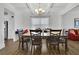 Bright dining room featuring hardwood floors, coffered ceiling, and neutral paint at 425 Eldridge Drive Dr, Suwanee, GA 30024