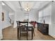 Bright dining room featuring hardwood floors, coffered ceiling, and neutral paint at 425 Eldridge Drive Dr, Suwanee, GA 30024