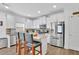 Modern kitchen with stainless steel appliances, white cabinetry, and granite countertops at 425 Eldridge Drive Dr, Suwanee, GA 30024