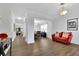 Bright living room featuring hardwood floors, coffered ceiling, and neutral paint at 425 Eldridge Drive Dr, Suwanee, GA 30024