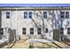 Exterior view of the home showcasing the backyard, patio, and gray siding at 689 Sunstone Ln, Lawrenceville, GA 30043