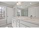 Bathroom featuring double vanity, bright windows, and contemporary fixtures at 689 Sunstone Ln, Lawrenceville, GA 30043