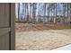 Large backyard with mature trees creating a private, natural setting at 693 Sunstone Ln, Lawrenceville, GA 30043