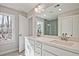 Bathroom featuring a dual sink vanity, large mirror and bright natural light at 693 Sunstone Ln, Lawrenceville, GA 30043