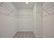 Walk-in closet featuring adjustable wire shelving and ample storage space at 693 Sunstone Ln, Lawrenceville, GA 30043