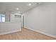 Upstairs hallway featuring a closet and wood-look floors at 693 Sunstone Ln, Lawrenceville, GA 30043