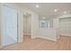 Upstairs hallway featuring laundry closet and neutral paint at 693 Sunstone Ln, Lawrenceville, GA 30043