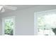 Bright bedroom with two windows providing ample natural light and a ceiling fan at 1391 Warrenton Hunt, Lawrenceville, GA 30043