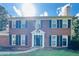 Close up of a home's front exterior showing the classic brick facade and trimmed windows at 1391 Warrenton Hunt, Lawrenceville, GA 30043