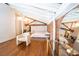 Cozy bedroom features hardwood floors, exposed brick, closet and dressing area at 1596 Cleveland Ave # 301, East Point, GA 30344