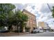 Brick multi-story building with green awnings, street parking, and a tree-lined street at 1596 Cleveland Ave # 301, East Point, GA 30344