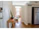 Hallway with hardwood floors leading to the living room featuring modern decor at 1596 Cleveland Ave # 301, East Point, GA 30344