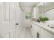 The bathroom offers a white vanity with modern fixtures and a window with natural light at 2057 Cambridge Ave, Atlanta, GA 30337