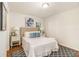 This bedroom features hardwood floors, neutral walls, and a patterned rug at 2057 Cambridge Ave, Atlanta, GA 30337